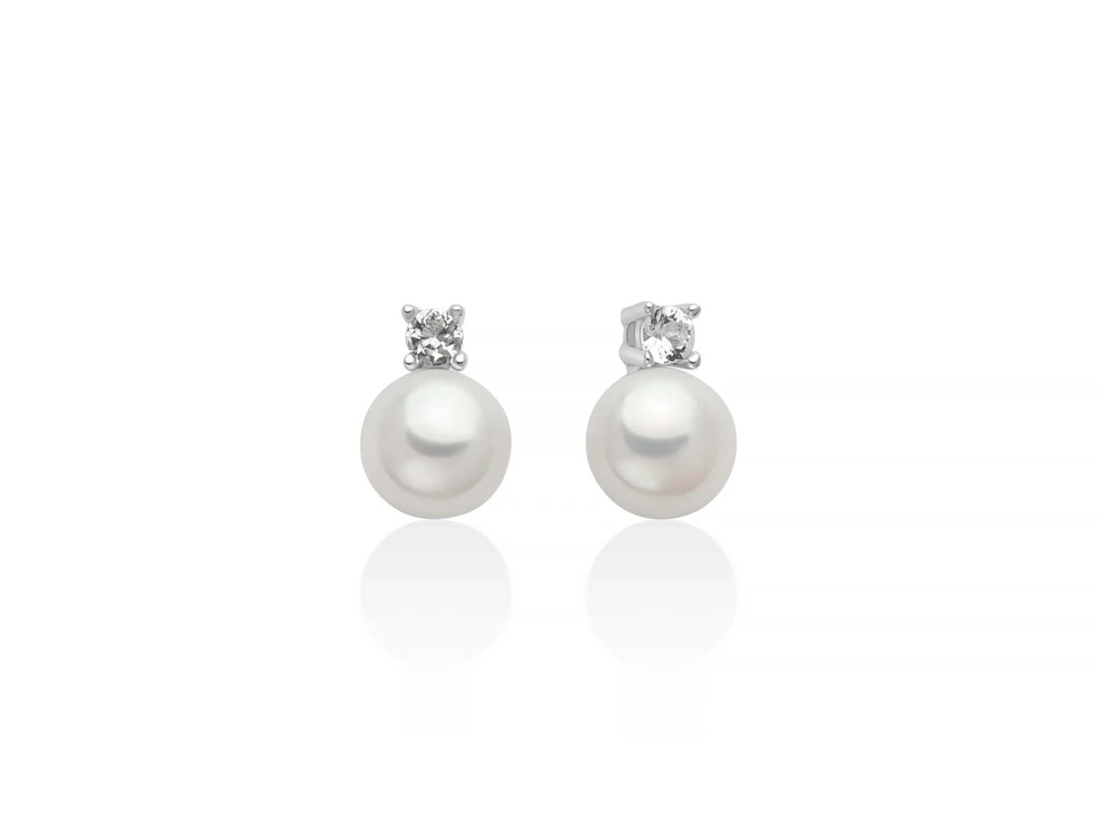 Orecchini Eva in argento con perla Oriente 6,5-7 mm illuminata da un topazio bianco.